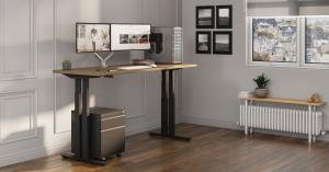 A four column standing desk in room with computer and accessories.