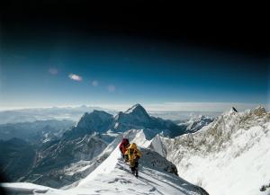 Climbers ascend the summit of Mt. Everest in a scene from the giant-screen documentary Everest.