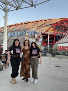 Farrah Mechael and Tamara Mechael standing outside Intuit Dome arena in Los Angeles.