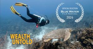 scuba diver swimming next to a turtle, with film title and festival laurel superimposed on image.