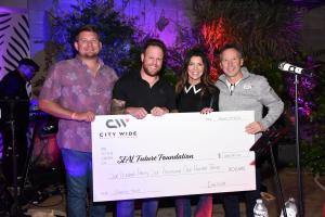 SEAL Future Foundation CPO Joey Fio receives donation check from City Wide Facility Solutions
