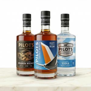 Three Pilot’s Legacy Spirits bottles including Kentucky Bourbon, Navy Strength Rum, and Classic Vodka displayed together.