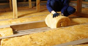 Technician insulation an attic