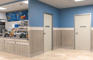 FlexFit frames on doors in a convenience store setting.