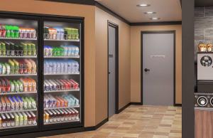 FlexFit frames on doors in a convenience store setting.