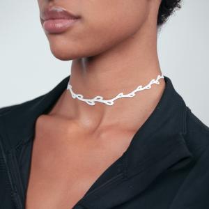 Model wearing Sweet Ivy Choker Necklace in White Verdasil with Black Jacket