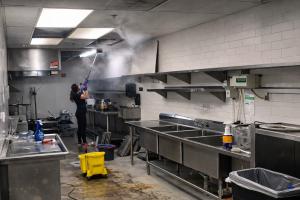 Deep cleaning of commercial kitchen infrastructure, including ceilings, ventilation, and work surfaces.