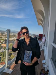 Joe Anselm of Freedom Man Band, star of upcoming film "Chasing Summer," at "A Toast to Hollywood" gifting lounge, Beverly Hills, March 12, 2026. © moviereviewsandmore