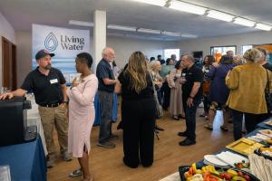 A crowded business networking event hosted by Poppy Bank where RO Living Water showcased eco-friendly reverse osmosis water systems for offices in Sonoma and Marin County.