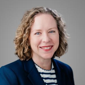 Heather Lyions smiling on light background