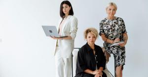 Professional women in a workplace setting representing leadership and growth.