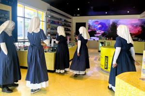 six sisters inside a large, well lit, dispensary