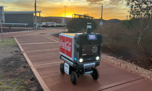 Ottobot autonomous delivery robot navigating a pathway at Rio Tinto's Gudai-Darri mine village in Western Australia