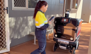 Sodexo Australia staff loading meals into Ottobot's insulated compartment at Rio Tinto Gudai-Darri village