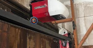 Custom wood carriage garage door repair at a historic residence in Long Beach, CA.