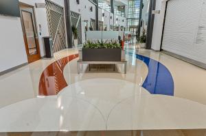 terrazzo floor with red and blue ribbons and white scallops.