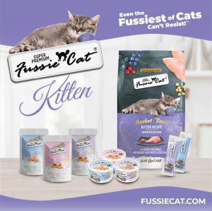 Fussie Cat Super Premium Kitten product line advertisement featuring dry food, wet food pouches, cans, and squeeze tubes on a purple and white background.