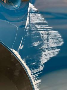 Car scratch repair Stamford specialist fixing deep paint scratches in The Cove neighborhood.