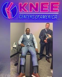 Duane Clemons receiving Accu‑KNEE® treatment at the DISC Centers of America / LIFE University Outpatient Clinic, with Dr. Steve Novelli in the background.