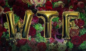 an oil on dibond art piece by Shane Levenson with three letters that appear to be balloon spelling out WTF with a backdrop of plants
