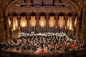 Musicians perform with the West Coast Symphony Orchestra on the Orpheum Theatre stage