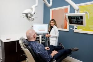 Modern general dentistry in action—Dr. Negar Eslami uses digital tools to guide exams and restorative treatment planning at Downtown Design Dental in Austin