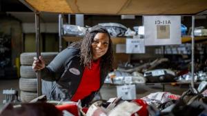 Natasha Broxton owner Select Auto Parts Milwaukee inspecting used auto parts inventory