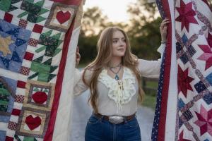 Singer SJ McDonald wrote a song titled "The Quilt" and made a video of her singing it The National Quilt Museum