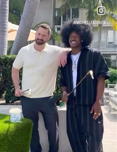 InStyler CEO Dan Fugardi and NFL Wide Receiver Ray Ray McCloud III each holding a gold Lucky Golf club