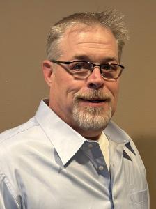 Portrait of Chris Fincke, Safety Manager at Holocene Drilling, known for leading USACE construction projects with zero lost-time incidents, achieving perfect safety audit scores, and developing award-winning safety training programs.