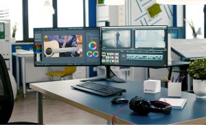 Kubb® Essentiel white mini PC on desk with dual monitors for video editing and creative work