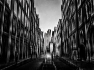 Black and white abstract urban ICM photograph with blurred architectural forms, deep contrast and vertical city motion.