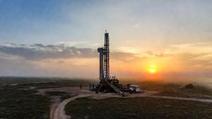 oilfield rig at sunset