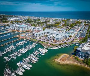 Aerial view of Little Creek Marina in Norfolk, Virginia showing boat slips, waterfront docks, and surrounding coastal community along the Chesapeake Bay
