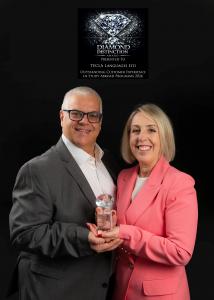 Directors of Tecla Languages holding a Diamond Distinction Award for outstanding customer experience in study abroad programmes 2026 against a black background