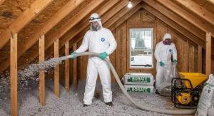 Technicians installing blown-in loose-fill attic insulation in Denver homes, using professional equipment to evenly distribute borate-treated material for energy efficiency and pest protection.