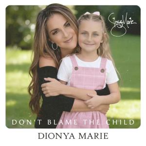 Picture of Dionya Marie hugging child in front of her