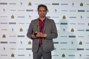 Chirag Patel holding Stevie Award, Head of Europe AI and Digital Transformation at Hidden Brains