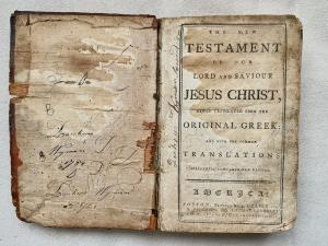 Inside front cover and first printed page of a 1777 New Testament Bible, printed in Boston by Edward Draper and sold March 15th by John McInnis Auctioneers for $199,500.