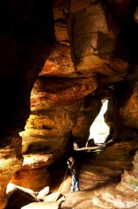 The trail to Rock House in the Hocking Hills is a short, moderately difficult hike, but the payoff is big as you enter the region's biggest true cave and experience the light beaming through its natural "windows."