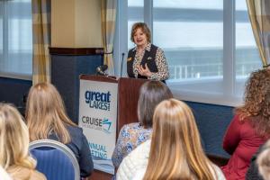 Sally Davis Berry speaking to guests at March 25 media briefing