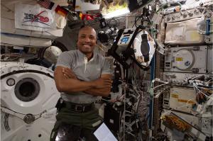 Naval Postgraduate School (NPS) alumnus, NASA astronaut and U.S. Navy Capt. Victor Glover piloted a SpaceX rocket to the International Space Station (ISS). Shown here aboard the ISS, Glover drifts in zero-g next to a free-floating NPS Astrobee robot.