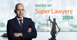Mark Sadaka in a suit with Super Lawyers 2026 recognition text and Lady Justice statue, representing New Jersey legal excellence