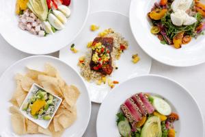 table with several plates of healthy food