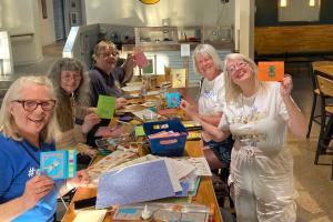 Carolyn Trevis and friends gathered at RailWerks Brewing in Columbia Heights, Minnesota, to create handmade cards for older adults through the Cards Connect program.