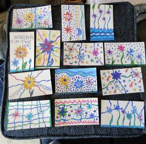 A display of beautiful, handmade spring cards by Kim Nguyen, created to brighten the days of older adults through the Cards Connect program.
