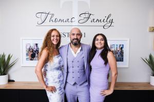Marty Thomas with wife Brandi and daughter Londyn at their Gilbert, AZ home. The Thomas family went all-in on lavender for the LLMA launch shoot.