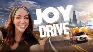 happy woman next to RV on an open road with U.S. landmarks