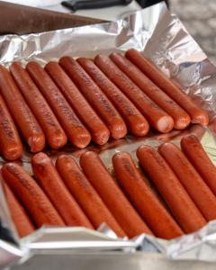 Snap-O-Razzo Big Sexy® Dog 9-inch hot dogs on foil pan griddle hot dogs with a snap