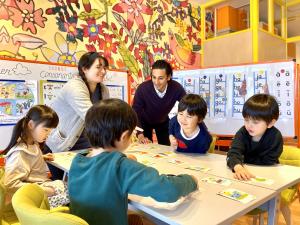 International teachers playing an educational game with Japanese school students